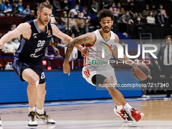 Andrey Zubkov (L) of Zenit and Nick Weiler-Babb of Bayern in action during the EuroLeague Basketball match between Zenit St. Petersburg and...