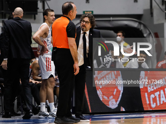 Bayern head coach Andrea Trinchieri (C) argues with the referee during the EuroLeague Basketball match between Zenit St. Petersburg and FC B...