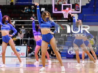 Zenit cheerleaders dance on the court with their protective masks on during the EuroLeague Basketball match between Zenit St. Petersburg and...
