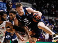 Andrey Zubkov #20 of Zenit in action against Corey Walden (L) and Augustine Rubit of Bayern during the EuroLeague Basketball match between Z...