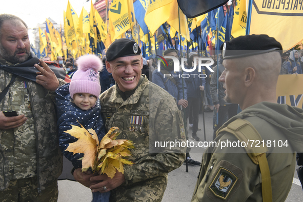Veterans of Russian-Ukrainian war , activists and supporters of Ukraine's nationalist movements,  take part in a procession to mark the Defe...