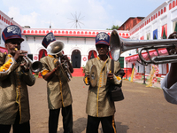 Local band members perfrom inside the Sovabazar Rajbari , an idol of a statue of the ten-handed Hindu Goddess Durga for an immersion in wate...