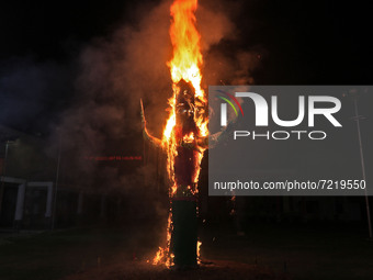 An effigy of 'Ravana' burns during the Dussehra celebrations at Shree Rammandir Adarsh Nagar, in Jaipur, Rajasthan, India,Friday, Oct. 15, 2...