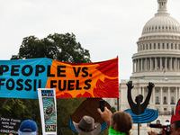 Native American climate activists and allies march to the US Capitol during a youth-led protest against the continued use of fossil fuels, o...