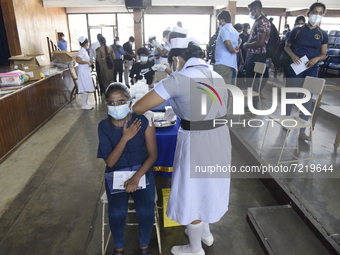 A Sri Lankan School Student receiving his first dose Pfizer-BioNTech vaccine in a vaccination center near Colombo, Sri Lanka October 15, 202...