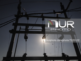 Power lines are installed with an Electricity transformer in Sopore, District Baramulla, Jammu and Kashmir, India on 15 October 2021. (