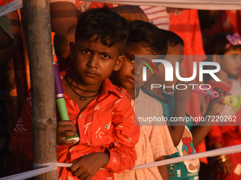 Children looking immersion of  idol of the Hindu Goddess Durga on the last day of Durga Puja Festival on October 15, 2021 in Barpeta, India....