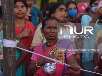Women looking immersion of  idol of the Hindu Goddess Durga on the last day of Durga Puja Festival on October 15, 2021 in Barpeta, India. So...