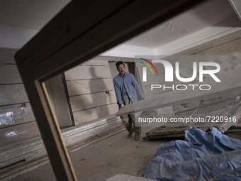Abdolghani Jamshidi-60, An Afghan refugee, works in a residential building which is currently under construction, in the Mehrshahr area in t...