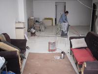 Abdolghani Jamshidi-60, An Afghan refugee who works as a construction worker, cleans his living area which is a room of a residential buildi...