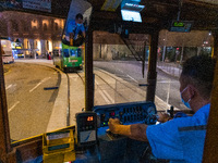 A tram conductor operates his tramway in Central Hong Kong. (