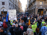 protesters with placards against the obligation of the GreenPass.
No Vax and No Green Pass protesters protested in Padua, Italy, on October...