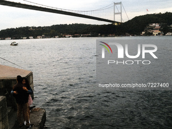 Couple hugging against landscape in Rumeli Fortress in Istanbul, Turkey on Octaber 16, 2021. (