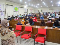 Dhaka University students wearing face masks attend their class after one and half year reopened maintaining Covid-19 guidelines and health...