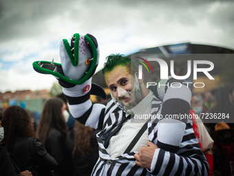 A cosplayer uses a costume of BeetleJuice during the fourth day of the SOFA (Salon del Ocio y la Fantasia) 2021, a fair aimed to the geek au...