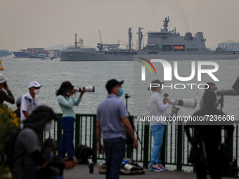 People take pictures of the New Zealand's HMNZS Aotearoa naval vessel at Marina South on October 18, 2021 in Singapore. The Five Power Defen...