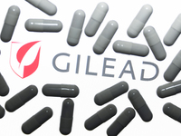 Gilead Sciences logo displayed on a laptop screen and medical pills are seen in this illustration photo taken in Krakow, Poland on October 1...