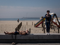 People are enjoy the hot weather at Matosinhos beach on October 18, 2021, a city and a municipality in the northern Porto district of Portug...