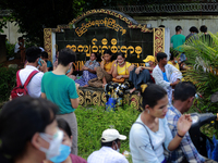 Relatives wait for the released of prisoners, outside Insein prison in Yangon, Myanmar on October 19, 2021, following the February military...