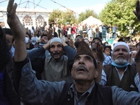 People react as the priest displays Relic which is believed to be the Hair of Prophet Muhammad (PBUH) in Hazratbal shrine on the eve of Eid-...
