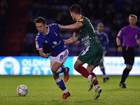 Oldham Athletic's Callum Whelan tussles with Jack Earing of Walsall Football Club during the Sky Bet League 2 match between Oldham Athletic...