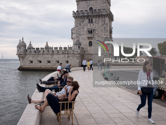 Tourists visit the Torre de Belem (Belem Tower) in Lisbon, Portugal on October 19, 2021. (