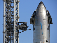 The Starship launch tower is seen with one of its arms connected behind S20 on October 19th, 2021.  (