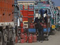 Truck drivers purchase LPG cylinders at Fruit mandi in Sopore, District Baramulla, Jammu and Kashmir, India on 20 October 2021. Traders at F...