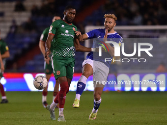    Oldham Athletic's Hallam Hope tussles with Emmanuel Osadebe of Walsall Football Club during the Sky Bet League 2 match between Oldham Ath...