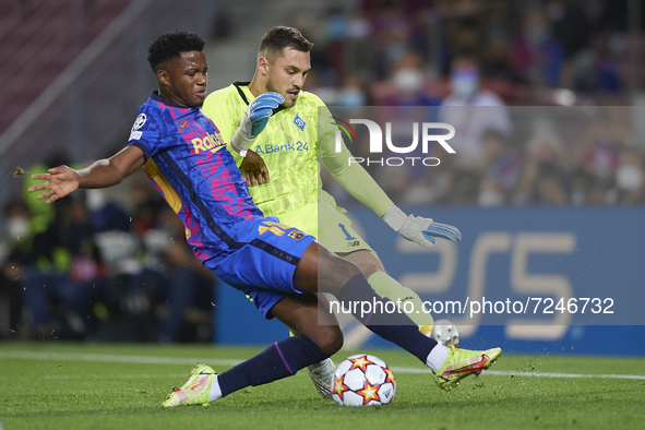 Ansu Fati of Barcelona and Georgiy Bushchan of Dinamo Kiev compete for the ball during the UEFA Champions League group E match between FC Ba...