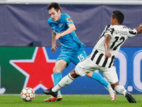 Vyacheslav Karavaev (L) of Zenit and Alex Sandro of Juventus vie for the ball during the UEFA Champions League Group H football match betwee...