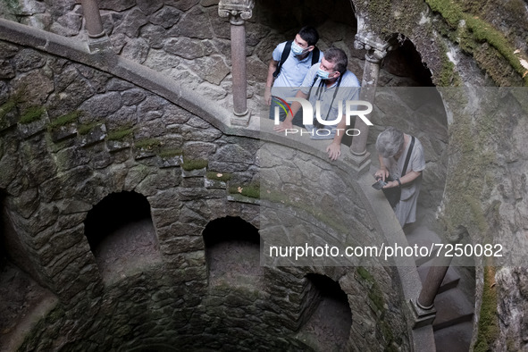 Tourists visit Initiation Well at Quinta da Regaleira in Sintra, Portugal on October 21, 2021. 