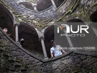 Tourists visit Initiation Well at Quinta da Regaleira in Sintra, Portugal on October 21, 2021. (