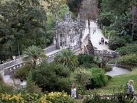 Tourists visit Quinta da Regaleira gardens and palace in Sintra, Portugal on October 21, 2021. (
