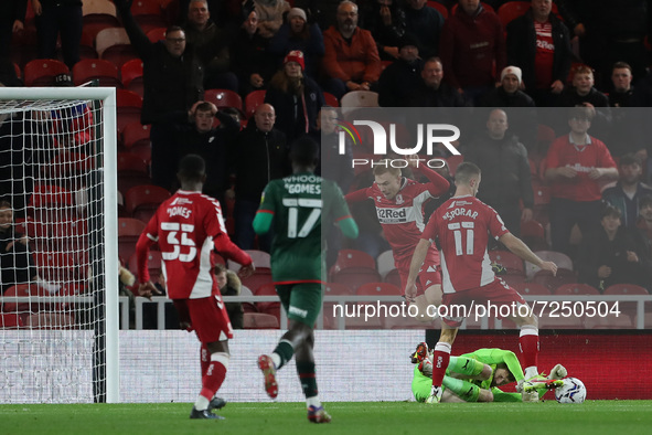  Middlesbrough's Duncan Watmore goes down after a challenge from Barnsley's Claudio Gomes during the Sky Bet Championship match between Midd...