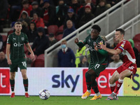  Aaron Leya Iseka of Barnsley battles for possession with Middlesbrough's Jonathan Howson during the Sky Bet Championship match between Midd...