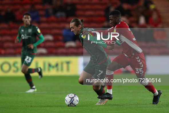  Callum Brittain of Barnsley in action with Middlesbrough's Isaiah Jones during the Sky Bet Championship match between Middlesbrough and Bar...