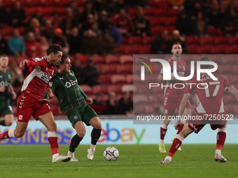 Middlesbrough's Martin Payero in action with Barnsley's Callum Brittain during the Sky Bet Championship match between Middlesbrough and Barn...