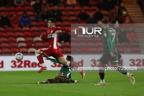 Middlesbrough's Martin Payero in action with Barnsley's William Hondermarck during the Sky Bet Championship match between Middlesbrough and...