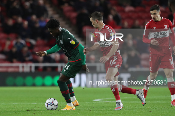  Barnsley's Aaron Leya Iseka takes on Middlesbrough's Jonathan Howson during the Sky Bet Championship match between Middlesbrough and Barnsl...