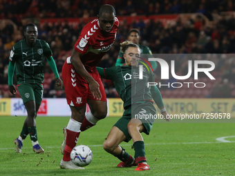  Uche Ikpeazu of Middlesbrough in action with Barnsley's Jordan Williams during the Sky Bet Championship match between Middlesbrough and Bar...