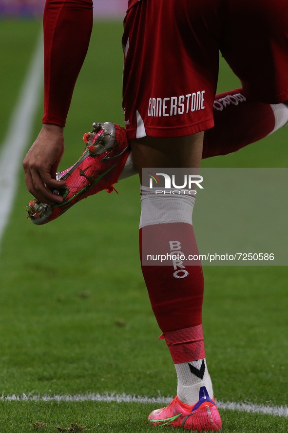  Middlesbrough's Marcus Tavernier removes mud from his studs during the Sky Bet Championship match between Middlesbrough and Barnsley at the...