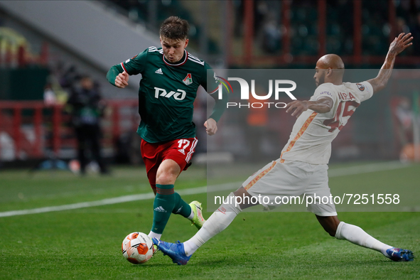 Rifat Zhemaletdinov (L) of Lokomotiv Moscow and Marcao of Galatasaray vie for the ball during the UEFA Europa League Group E football match...