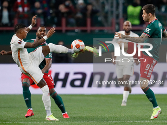 Fedor Smolov (R) of Lokomotiv Moscow and Patrick van Aanholt (L) of Galatasaray vie for the ball during the UEFA Europa League Group E footb...