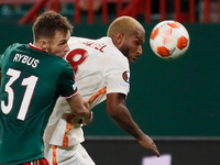 Maciej Rybus (L) of Lokomotiv Moscow and Ryan Babel of Galatasaray vie for the ball during the UEFA Europa League Group E football match bet...