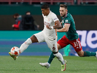 Maciej Rybus (R) of Lokomotiv Moscow and Patrick van Aanholt of Galatasaray vie for the ball during the UEFA Europa League Group E football...