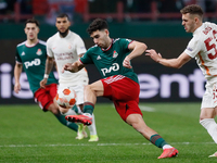 Nair Tiknizyan (C) of Lokomotiv Moscow in action against Baris Alper Yilmaz (R) of Galatasaray during the UEFA Europa League Group E footbal...