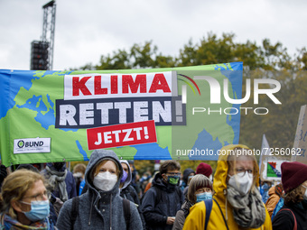People take part in the ''Friday For Future'' demonstration, in Berlin, Germany, on October 22, 2021. (