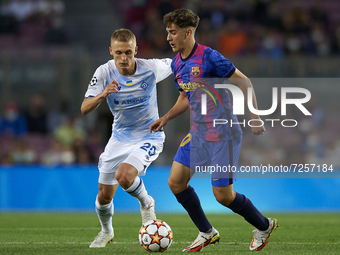 Gavi of Barcelona and Vitaliy Buyalskyi of Dinamo Kiev compete for the ball during the UEFA Champions League group E match between FC Barcel...