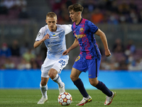 Gavi of Barcelona and Vitaliy Buyalskyi of Dinamo Kiev compete for the ball during the UEFA Champions League group E match between FC Barcel...
